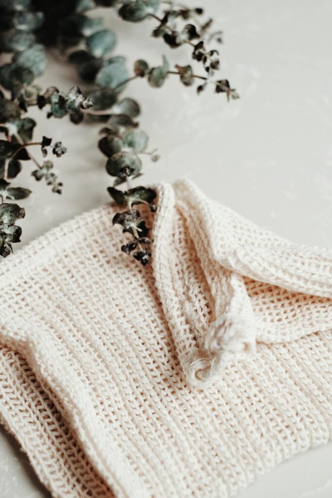 Minimalist handmade cotton washcloth with eucalyptus branches. Perfect for sustainable living.