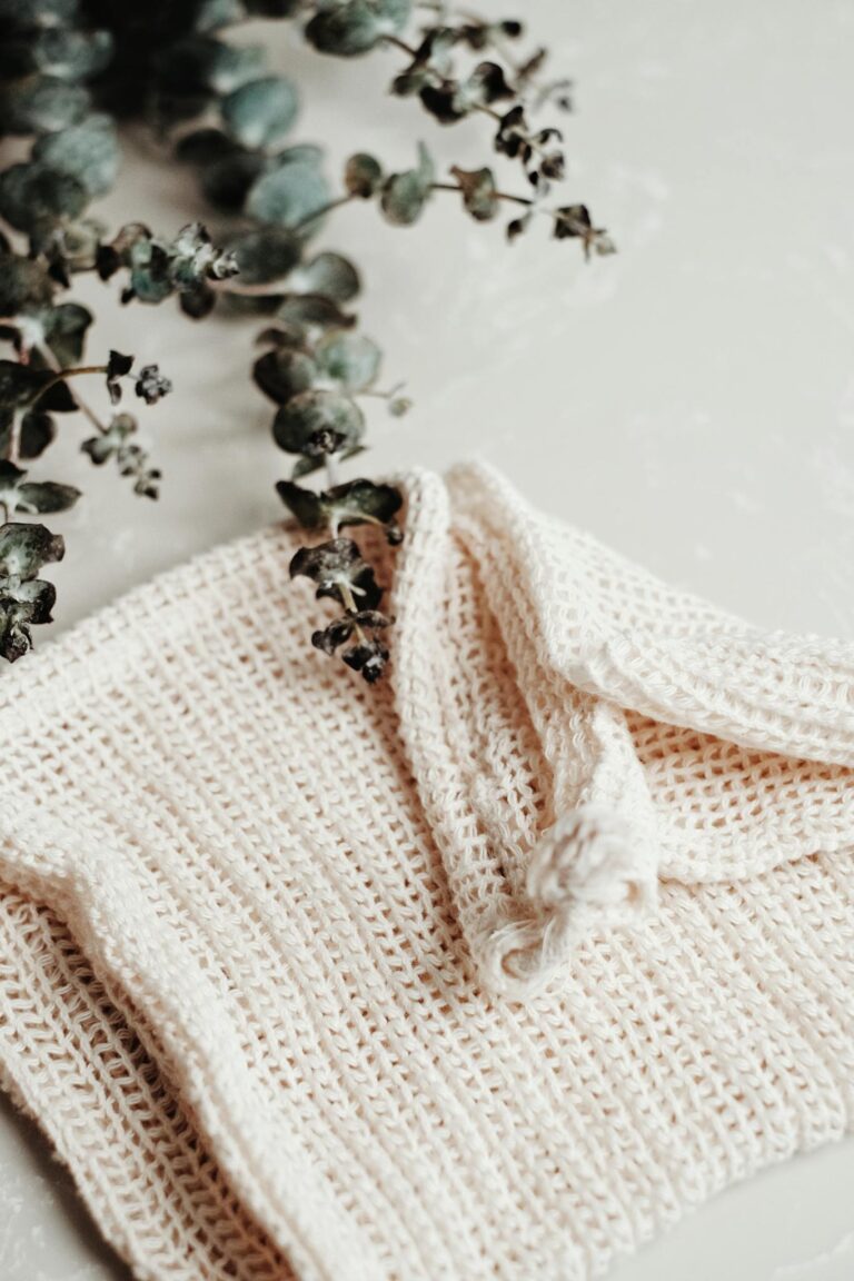 Minimalist handmade cotton washcloth with eucalyptus branches. Perfect for sustainable living.